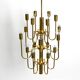 Three staged 18 arm Mid Century brass chandelier with a long brass rod