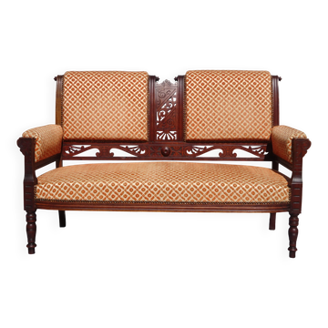 Old bench in wood and orange velvet