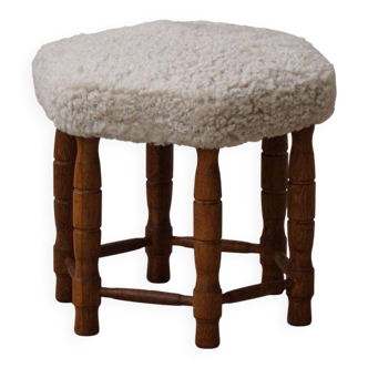 Modern Danish, a hexagonal oak stool, seat reupholstered in lambswool, 1950s.
