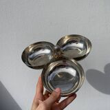 Silver-plated metal dish topped with an acorn