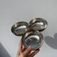 Silver-plated metal dish topped with an acorn