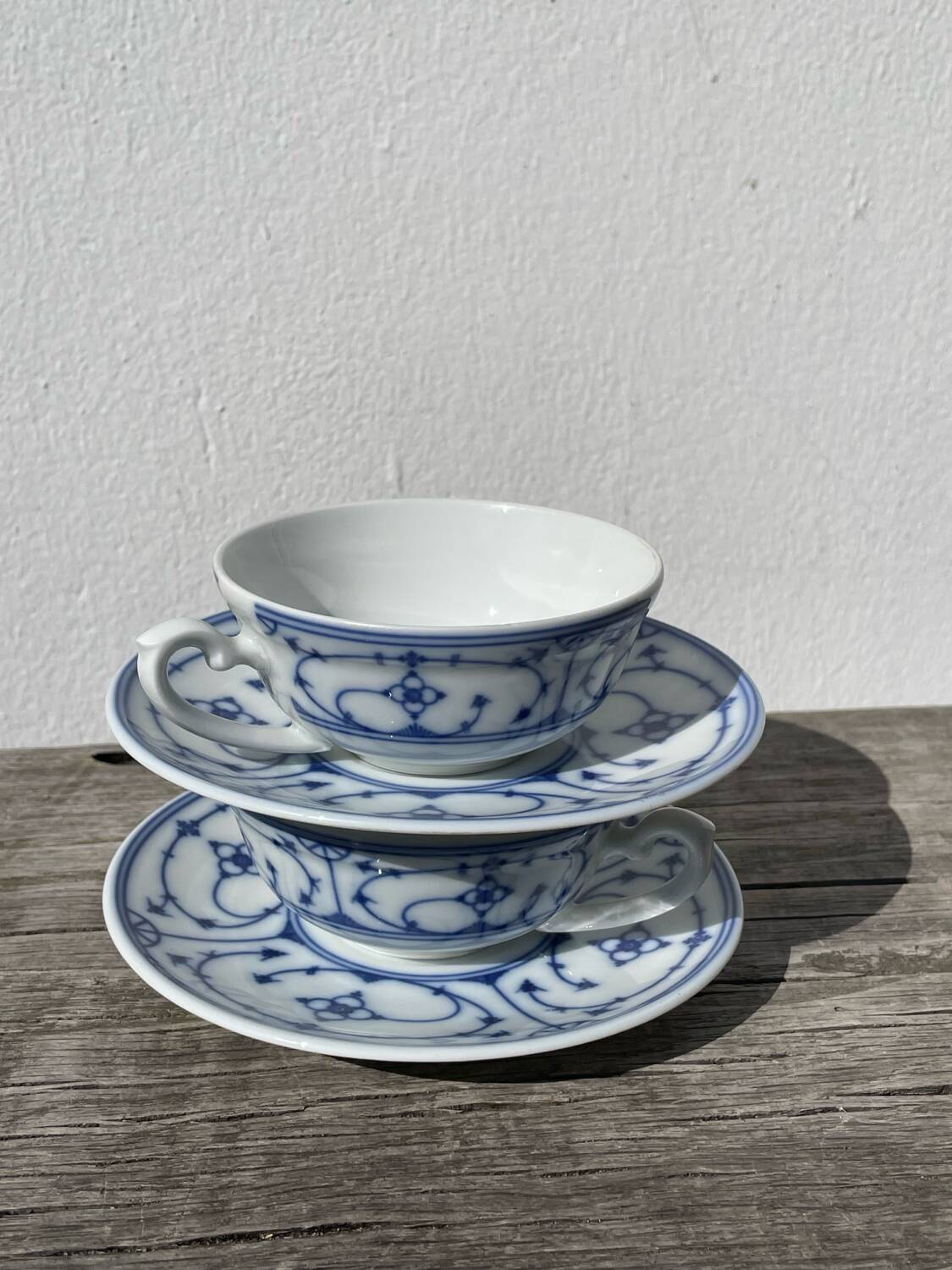 Pair of signed blue porcelain cups
