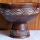 Cup on a pedestal in handcrafted scarified ceramic.