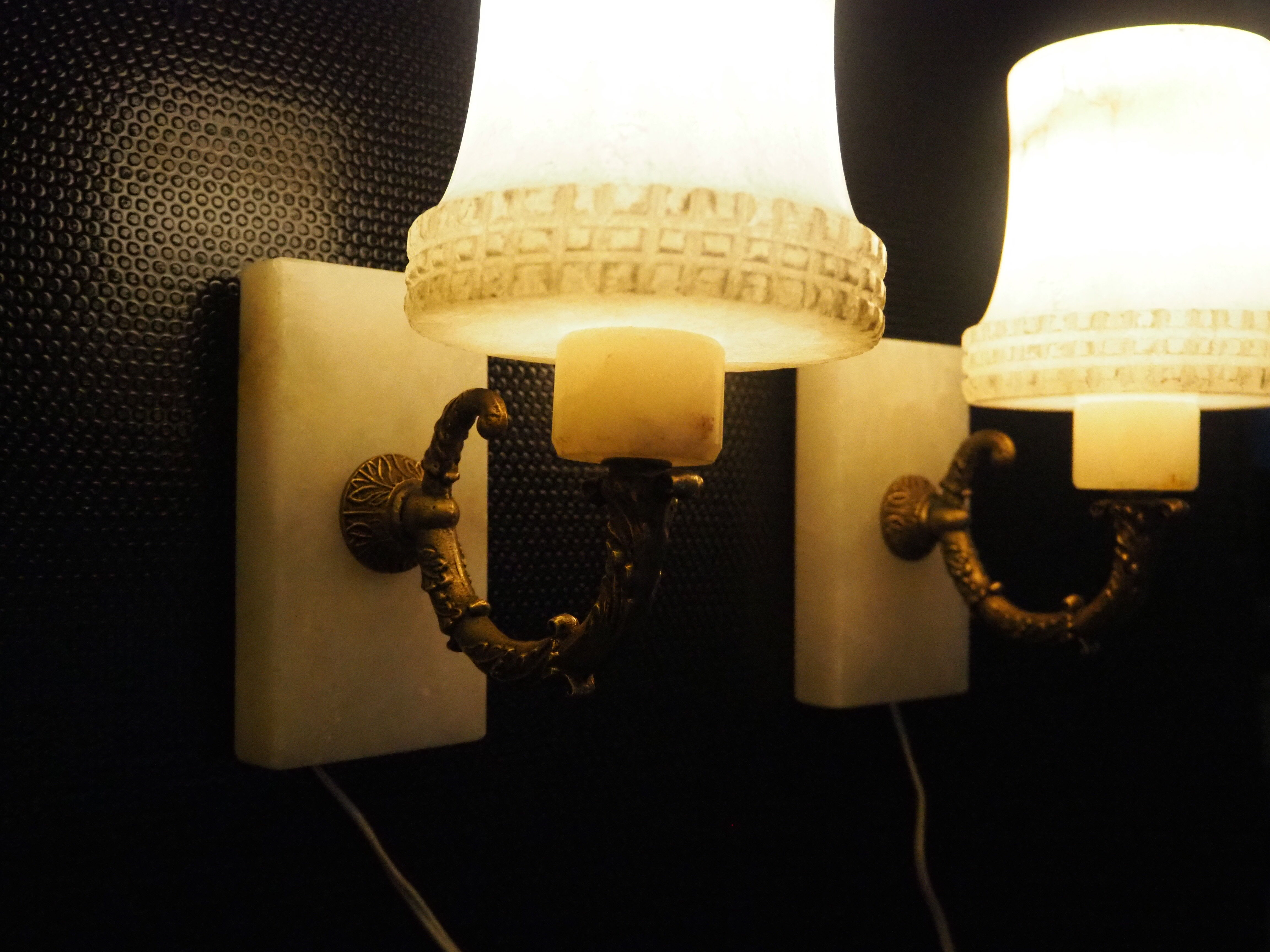 Pair of curved alabaster and bronze appliques