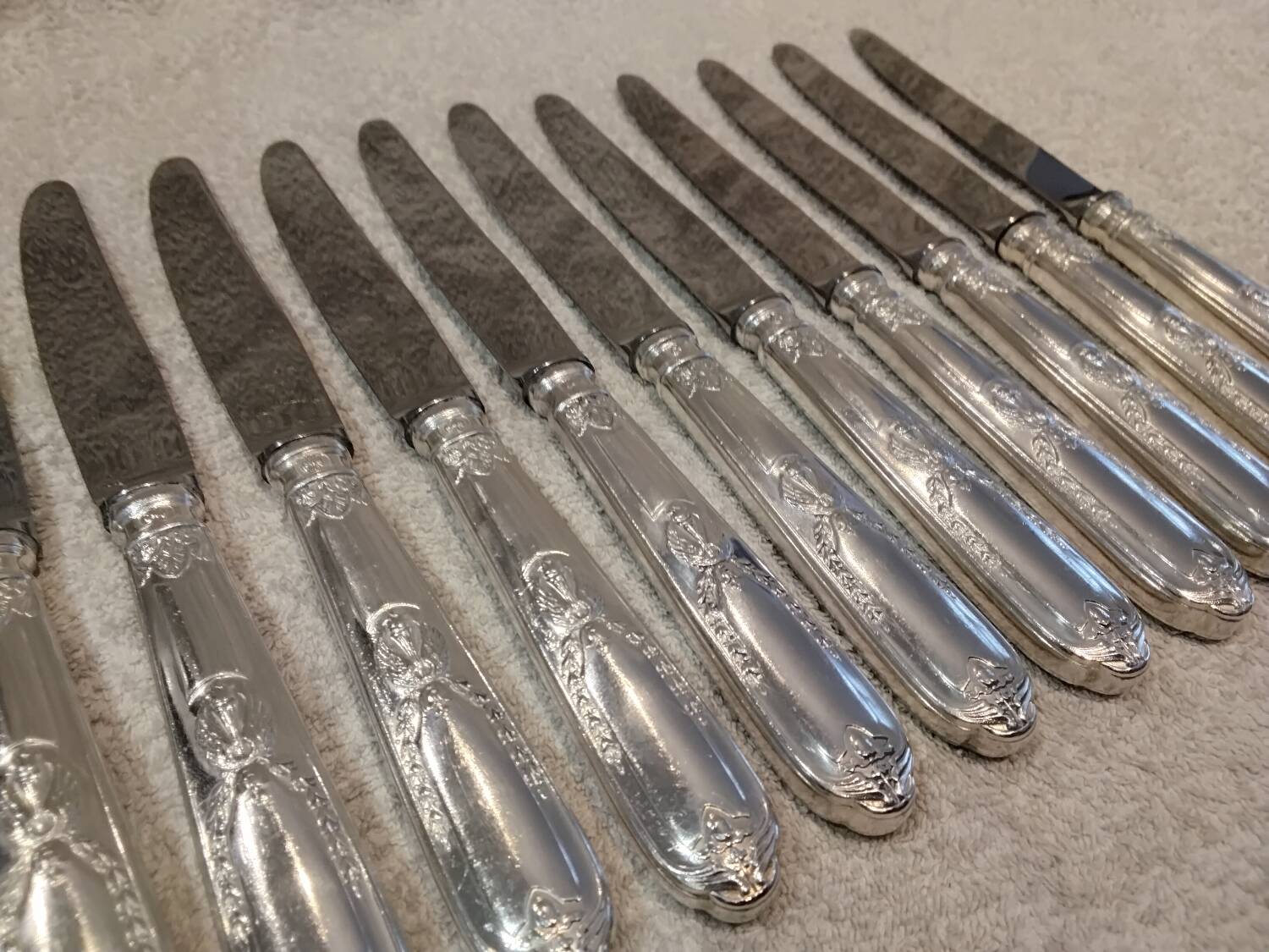 12 silver-plated metal table knives by the silversmith Ravinet Denfert, Empire style, model 81.
