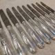 12 silver-plated metal table knives by the silversmith Ravinet Denfert, Empire style, model 81.