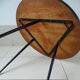 Round coffee table above resin flower decoration