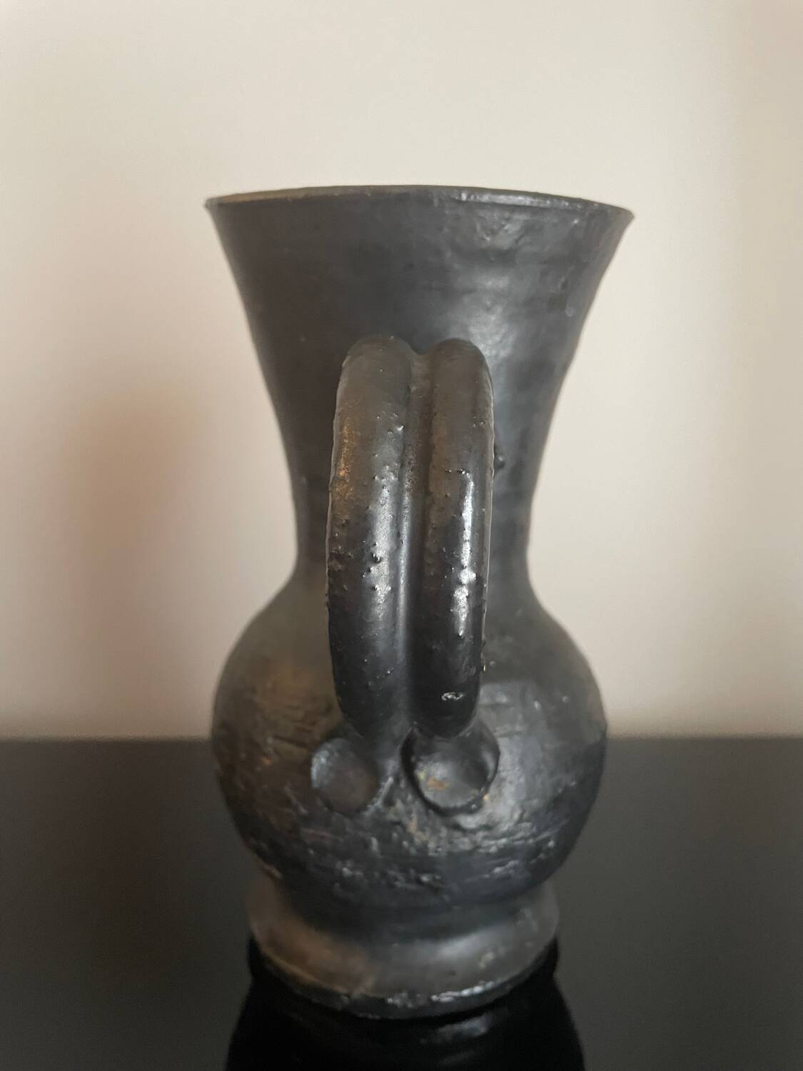 Black ceramic pitcher by Jean Marais