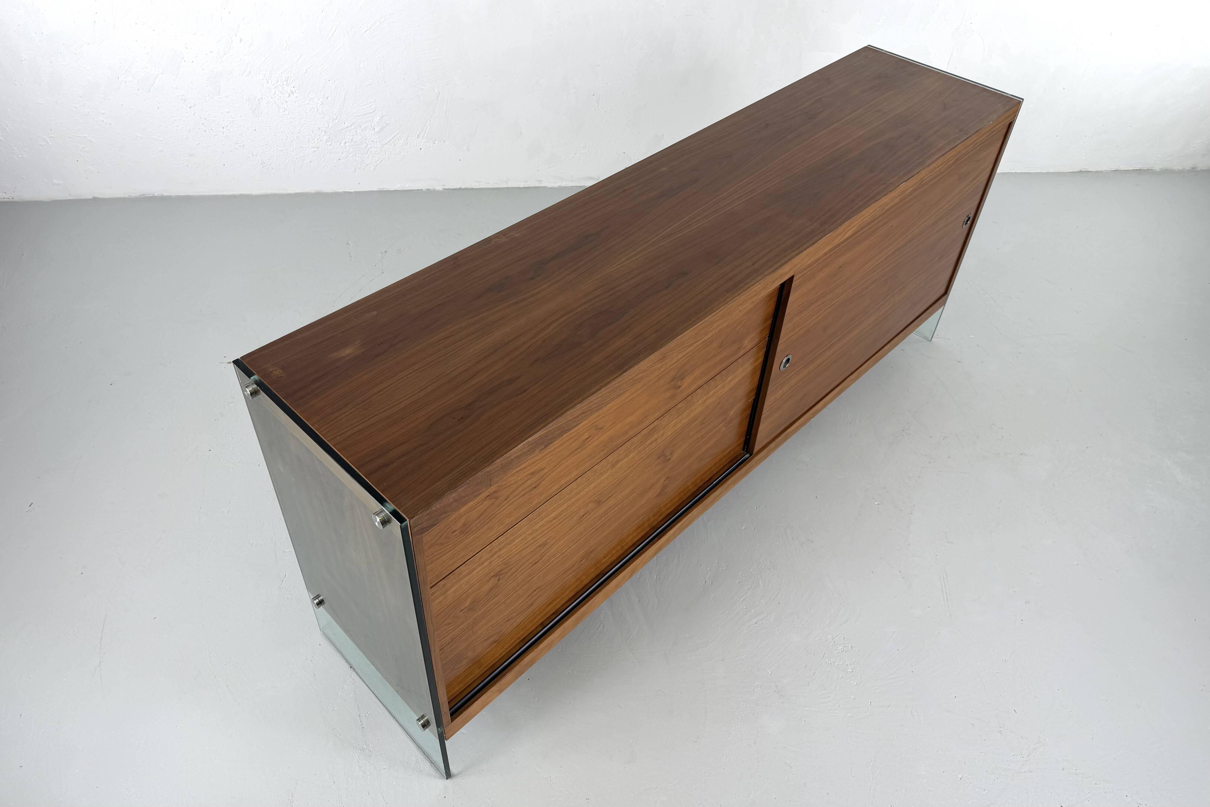 Teak sideboard with glass legs, France - 1990s