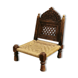 Ancient ethnic chair made of solid wood and rope