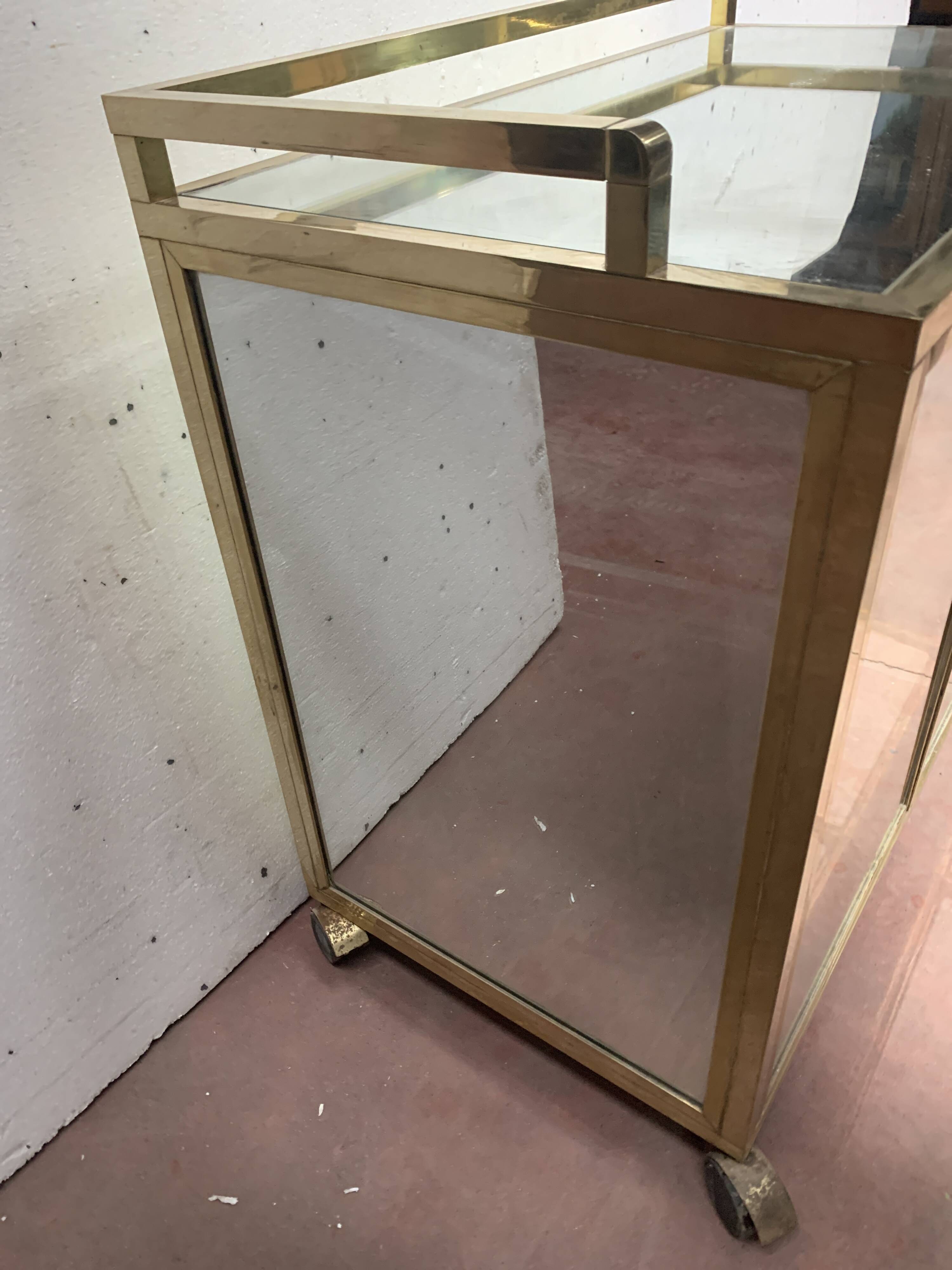 1970s brass bar with a mirrored front from the 20th century.