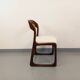 Vintage sled chair by Baumann in wood and boucle fabric.