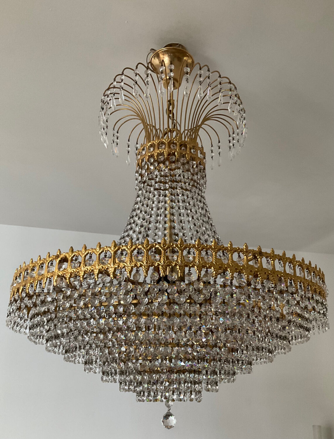 Chandelier cascade of tassels and brass