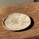 Small oval beige petrified wood dish or tray with speckled edges.