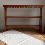 Vintage pine wall shelf with a scalloped front.