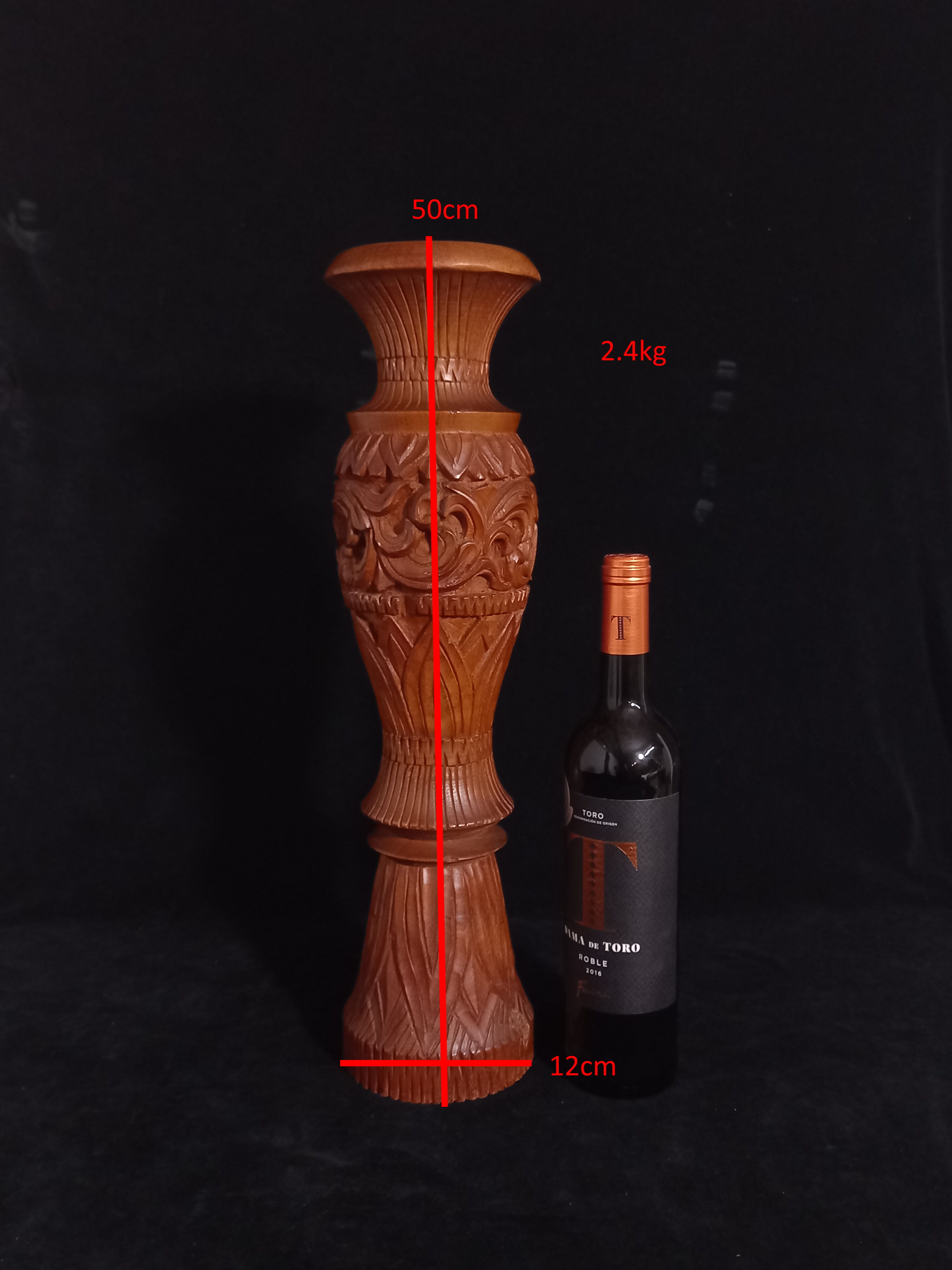 Exotic vase in carved wood