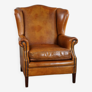 Fauteuil à oreilles en cuir de mouton de couleur miel clair