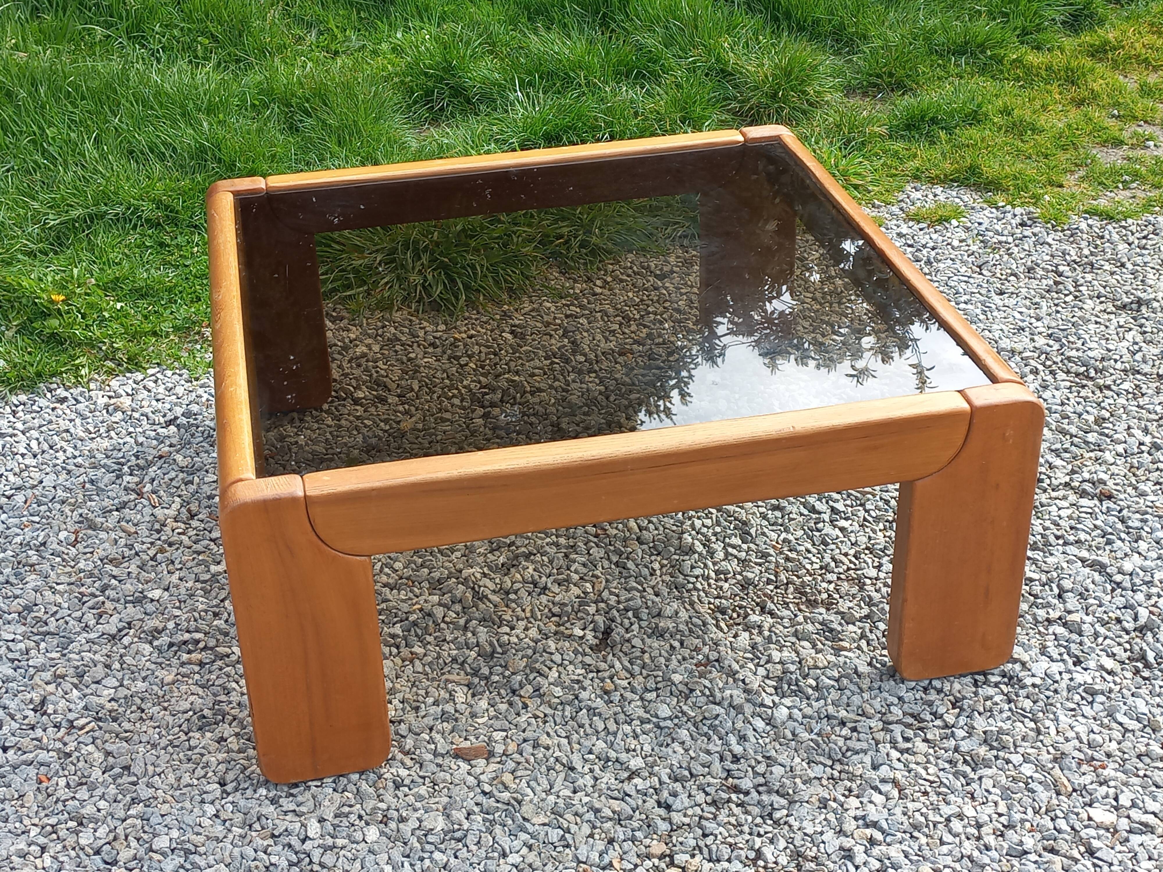 Coffee table from Regain in solid elm with a smoked glass top.