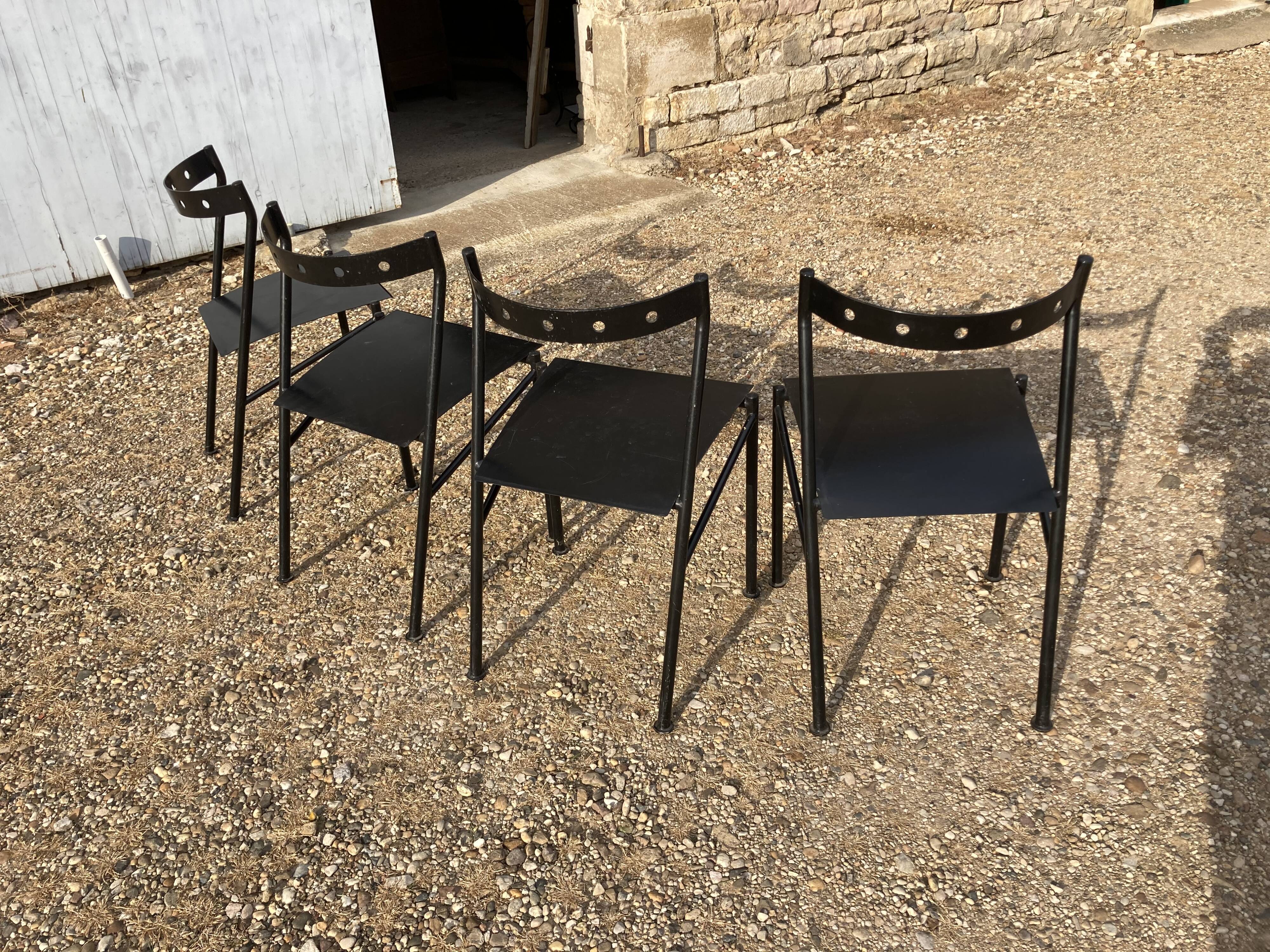 Series of 4 black iron chairs