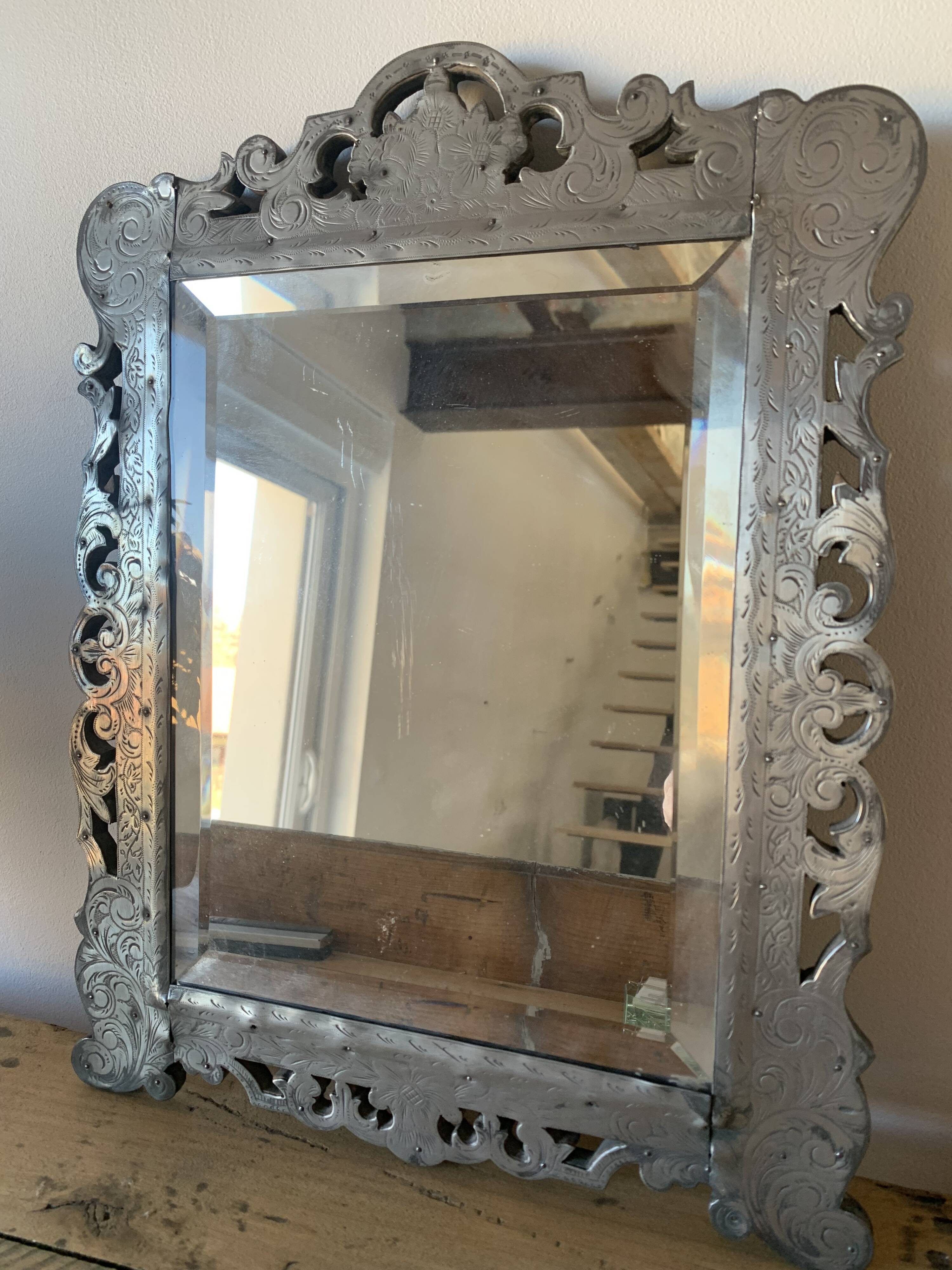 Eventful beveled mirror and openwork period 1900 repelled tin decoration