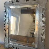Eventful beveled mirror and openwork period 1900 repelled tin decoration