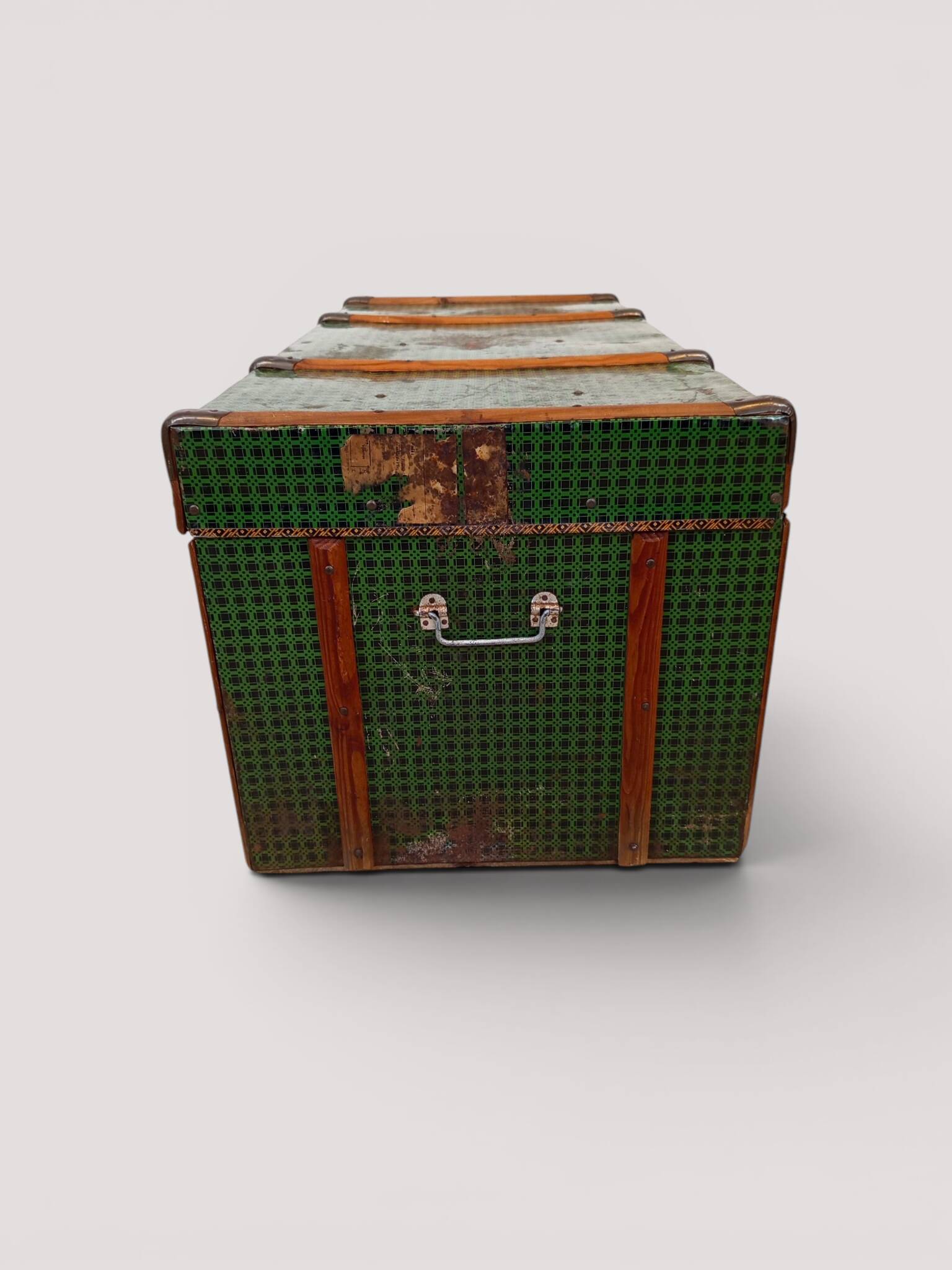 Vintage wooden and metal green travel trunk, circa 1930.