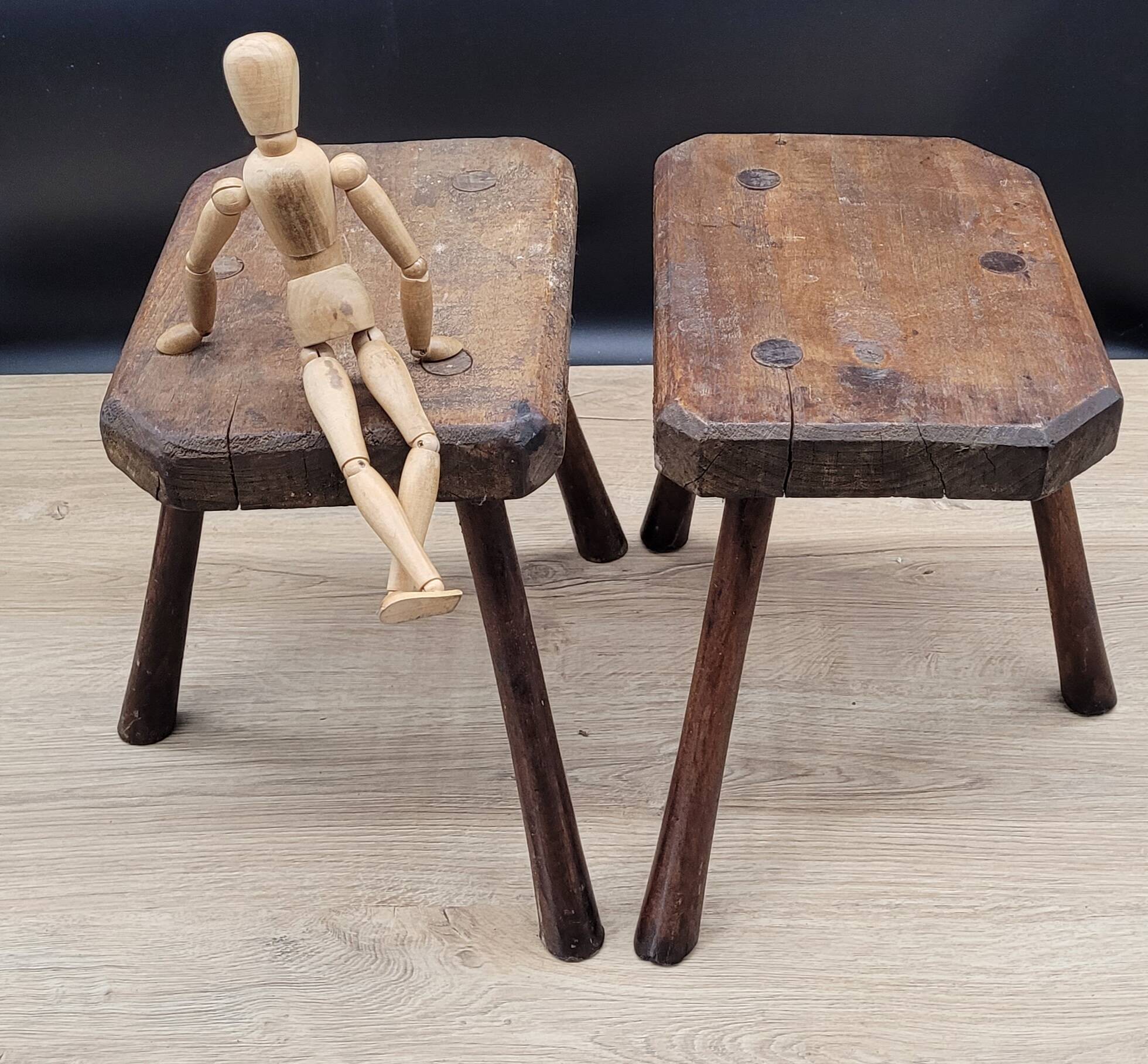 Pair of solid octagon cowhide tripod stools