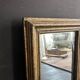 Miniature mirror from the 18th century in gilded wood, mercury glass.