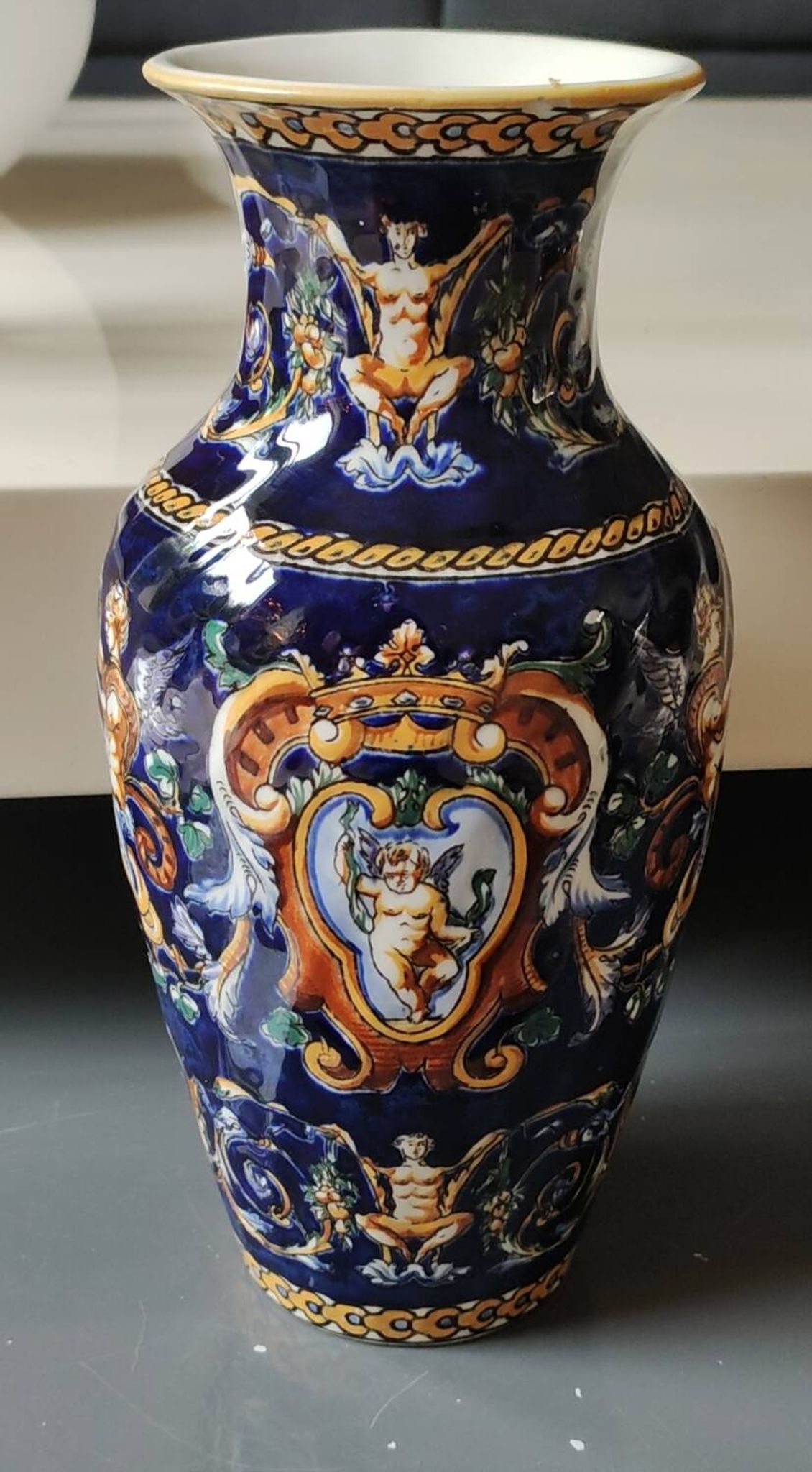 Twisted design vase. Signed Gien France/Renaissance blue background 26 x 13cm