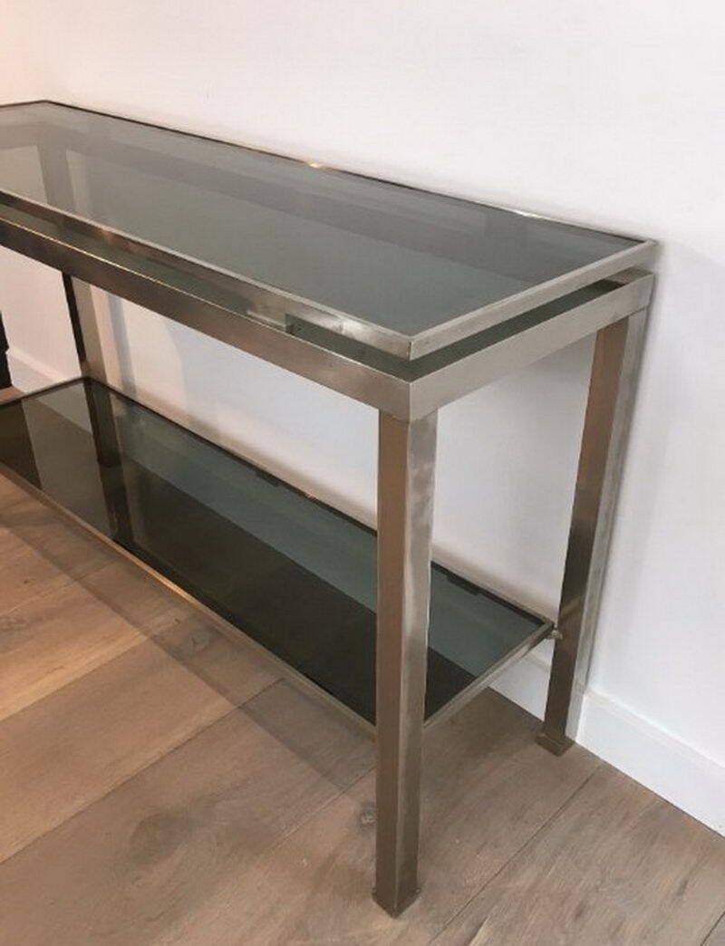 Beautiful console table in brushed metal with bluish glass shelves
