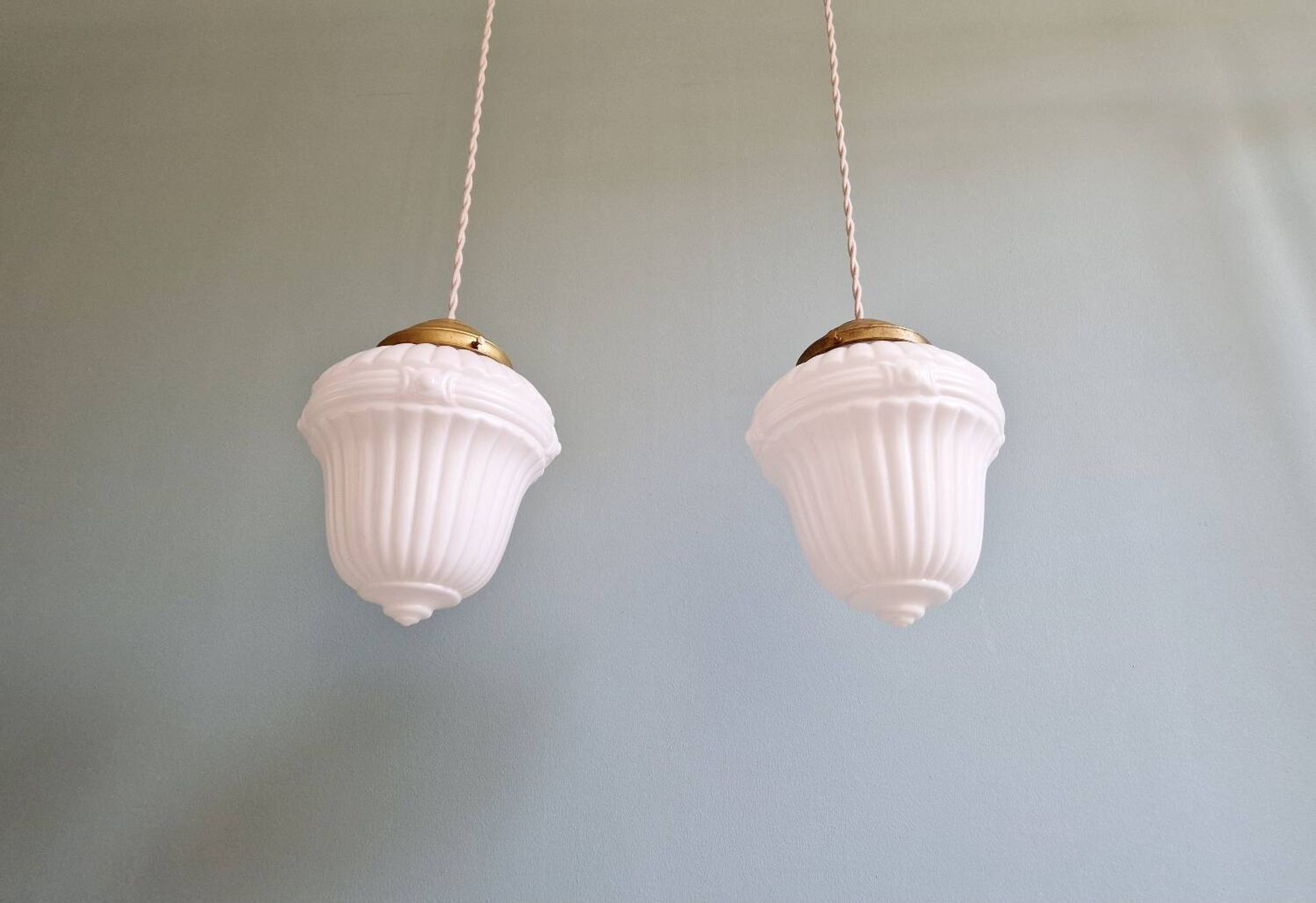 Pair of Art Deco pendant lights in pressed white opaline glass, 1920-30