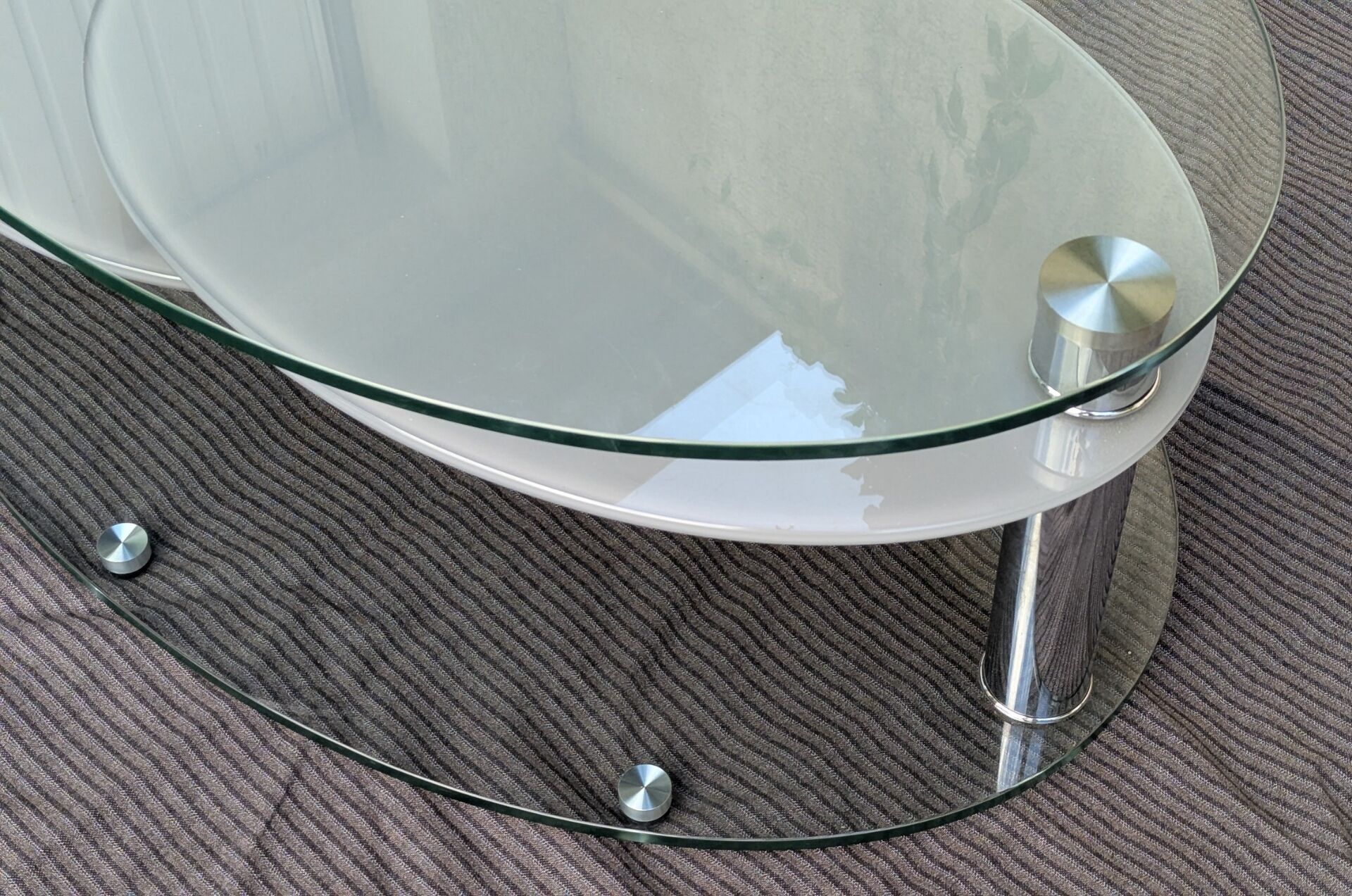 Coffee table with rotating glass tops by Antoine Motard.