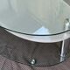 Coffee table with rotating glass tops by Antoine Motard.