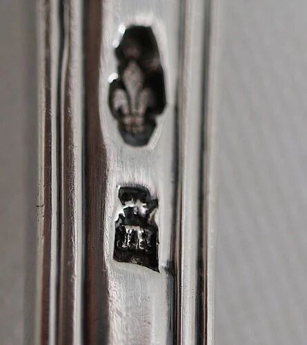 Serving spoon, silver, 18th century, straight thread pattern.
