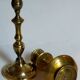 Duo of solid brass and gold metal candle holders worked old