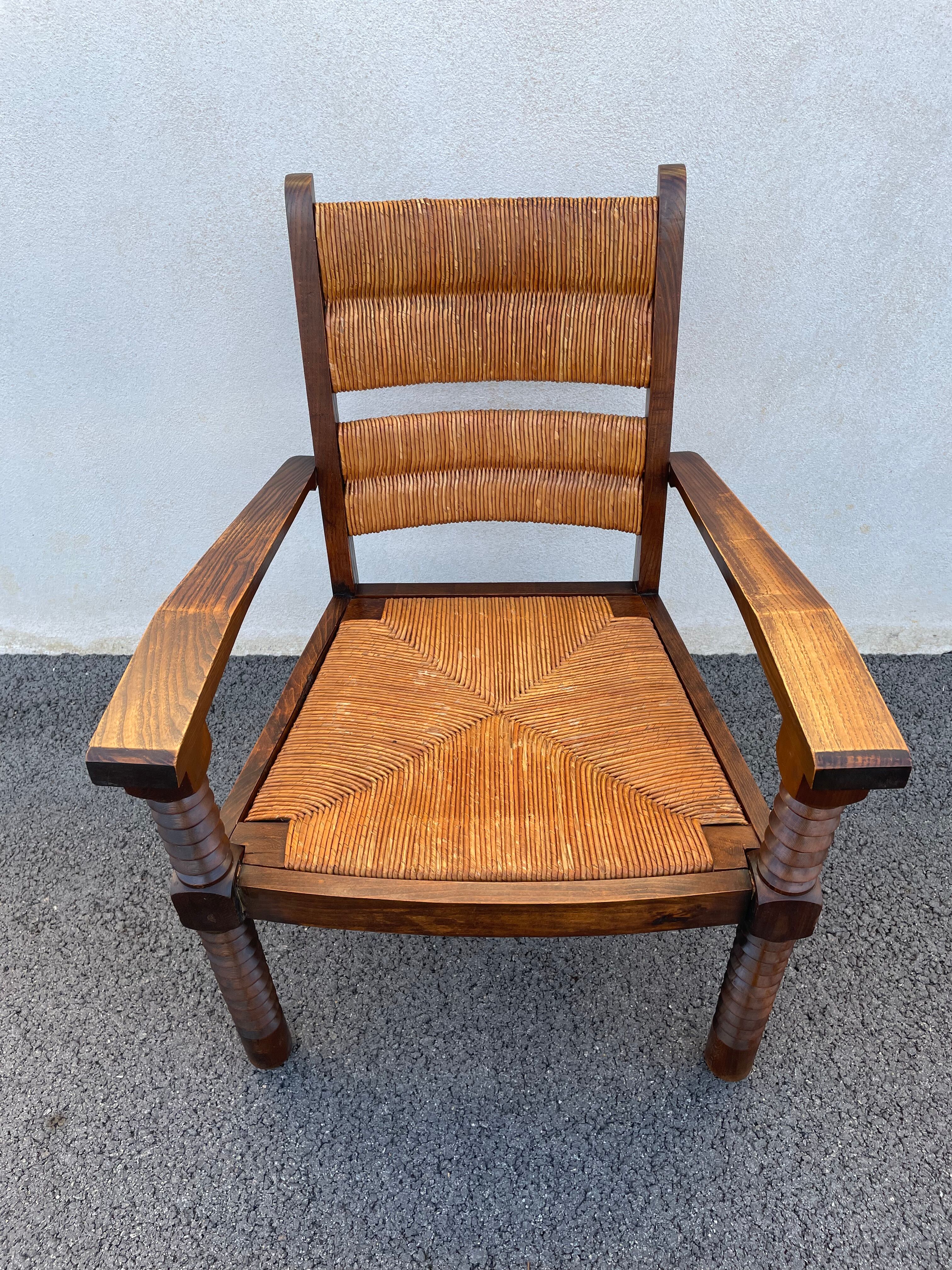 Vintage armchair in straw and brutalist wood
