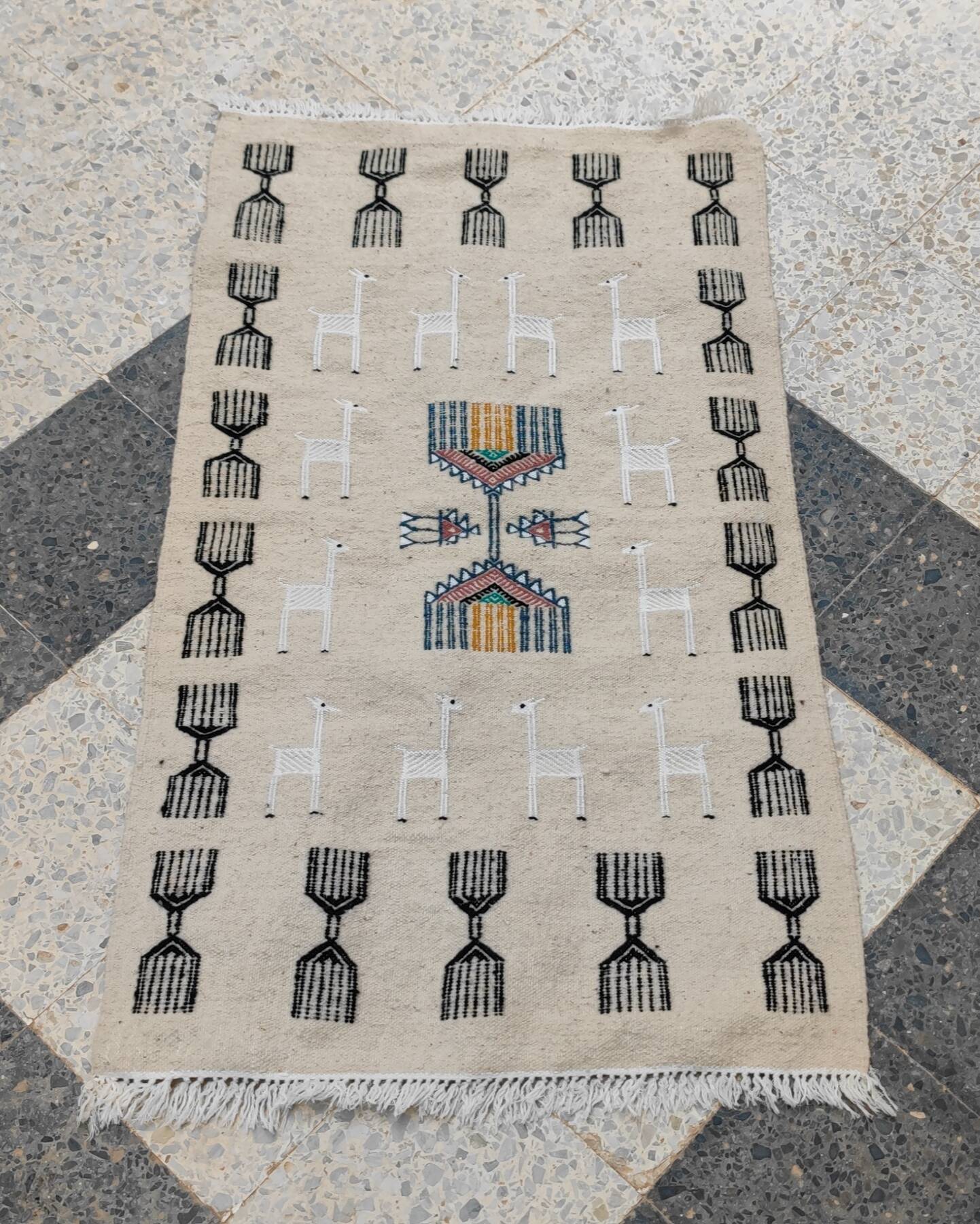 Handwoven kilim rug in natural wool