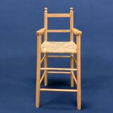 Old wooden and straw high chair for children