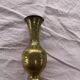 Golden brass vase chiseled vintage floral pattern