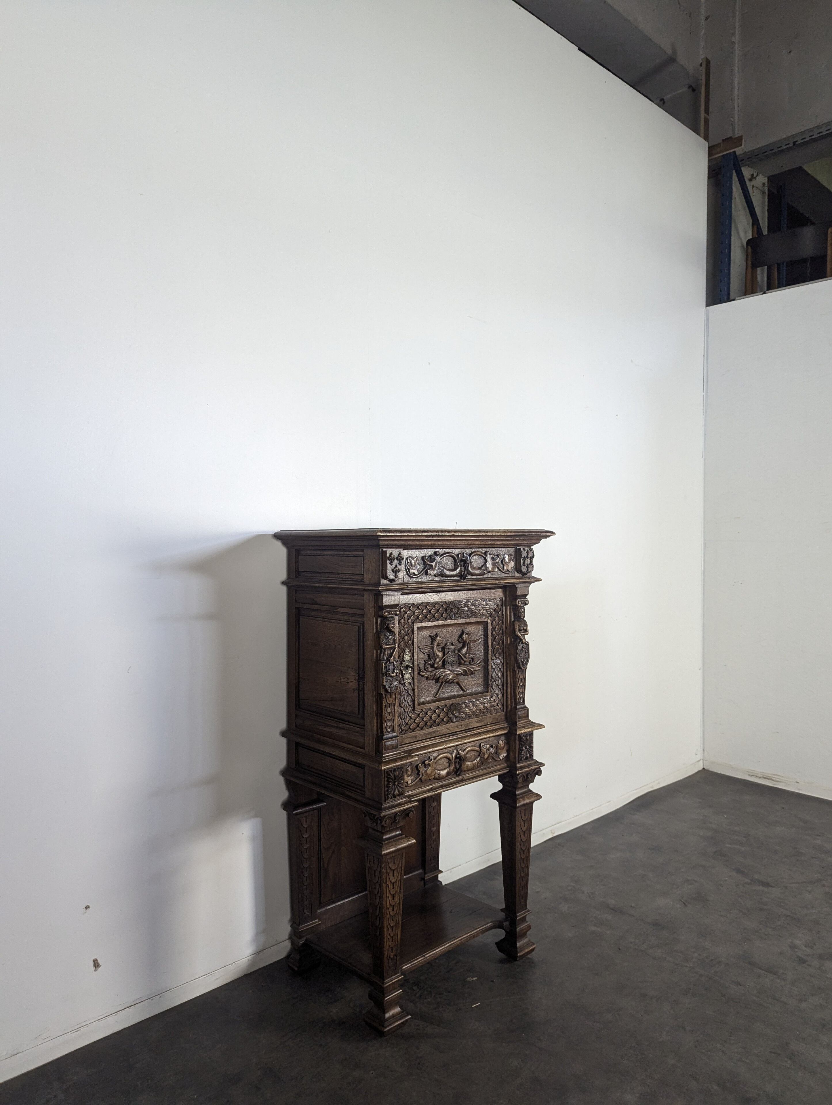Renaissance-style cabinet in solid oak decorated with chimeras and caryatids