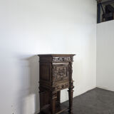 Renaissance-style cabinet in solid oak decorated with chimeras and caryatids