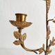 Antique bronze and brass candlestick with golden leaves
