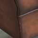 Comfortable cowhide wingback armchair in English style with a timeless look