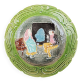 Old slipware plate: couple of peasants