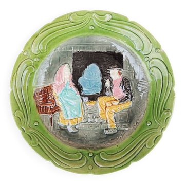 Old slipware plate: couple of peasants