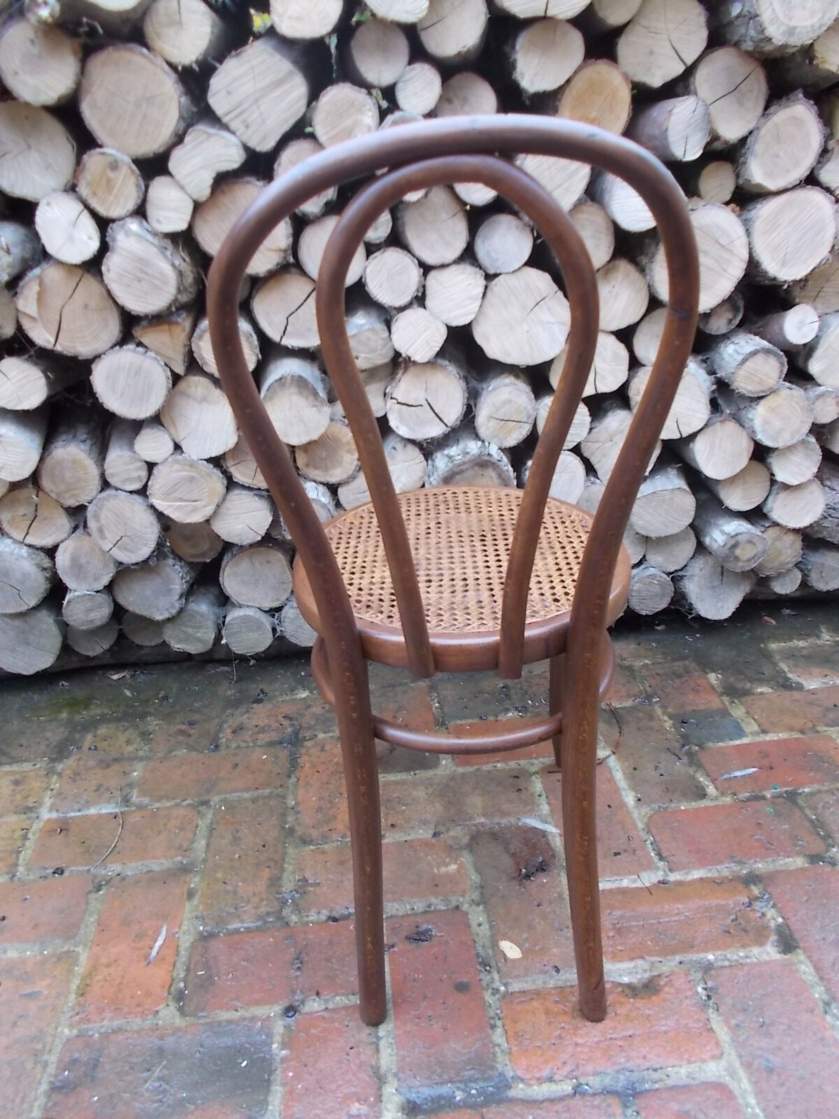 Curved wooden bistro chair and canning
