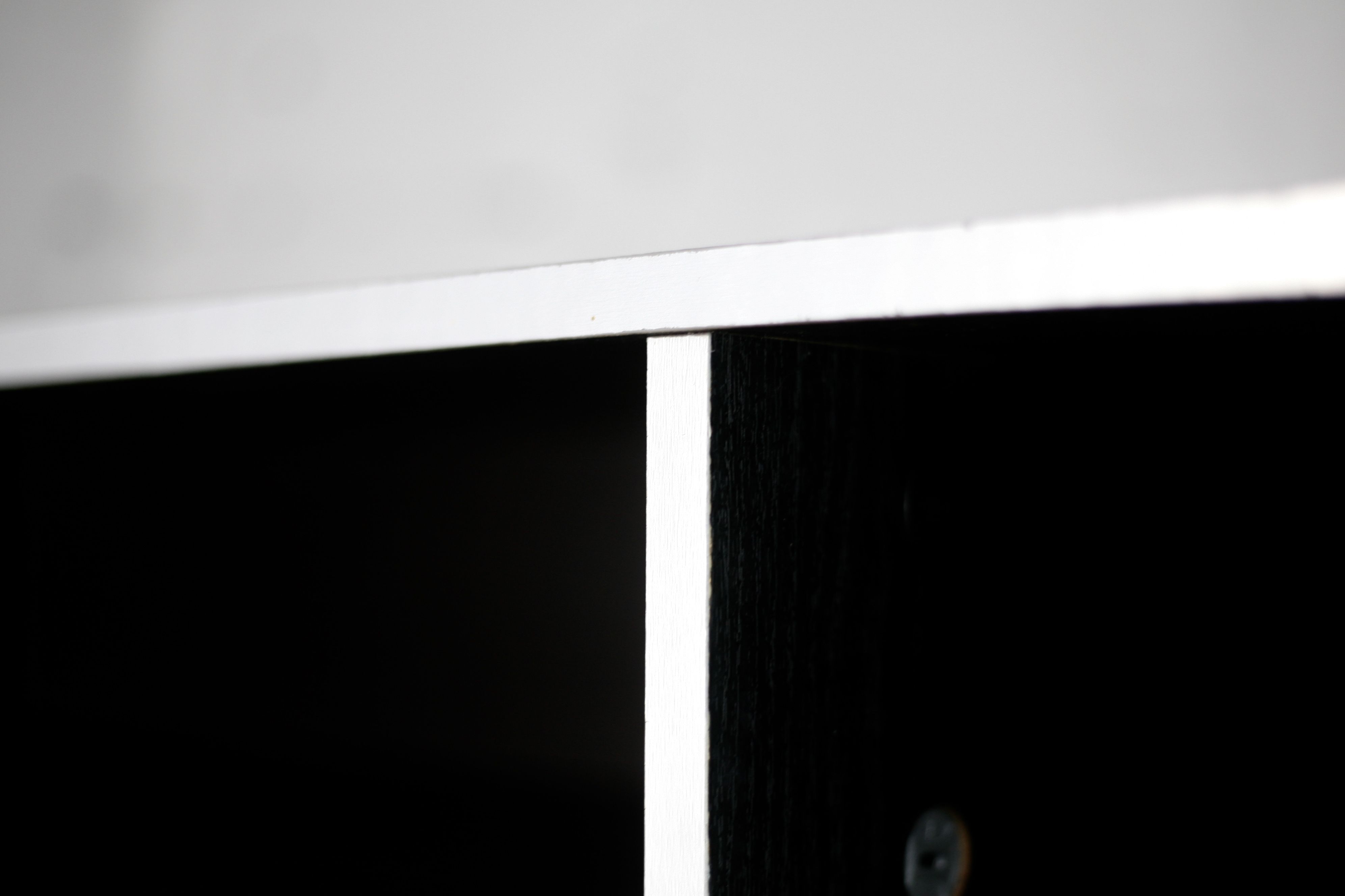 Storage cabinet wood compressed lacquered black lining margins aluminum. France, circa 1975.
