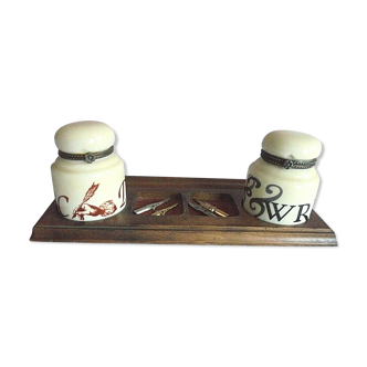 Antique ceramic inkwells on wood support with 4 feathers