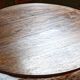 Three-legged side table in solid fruitwood.