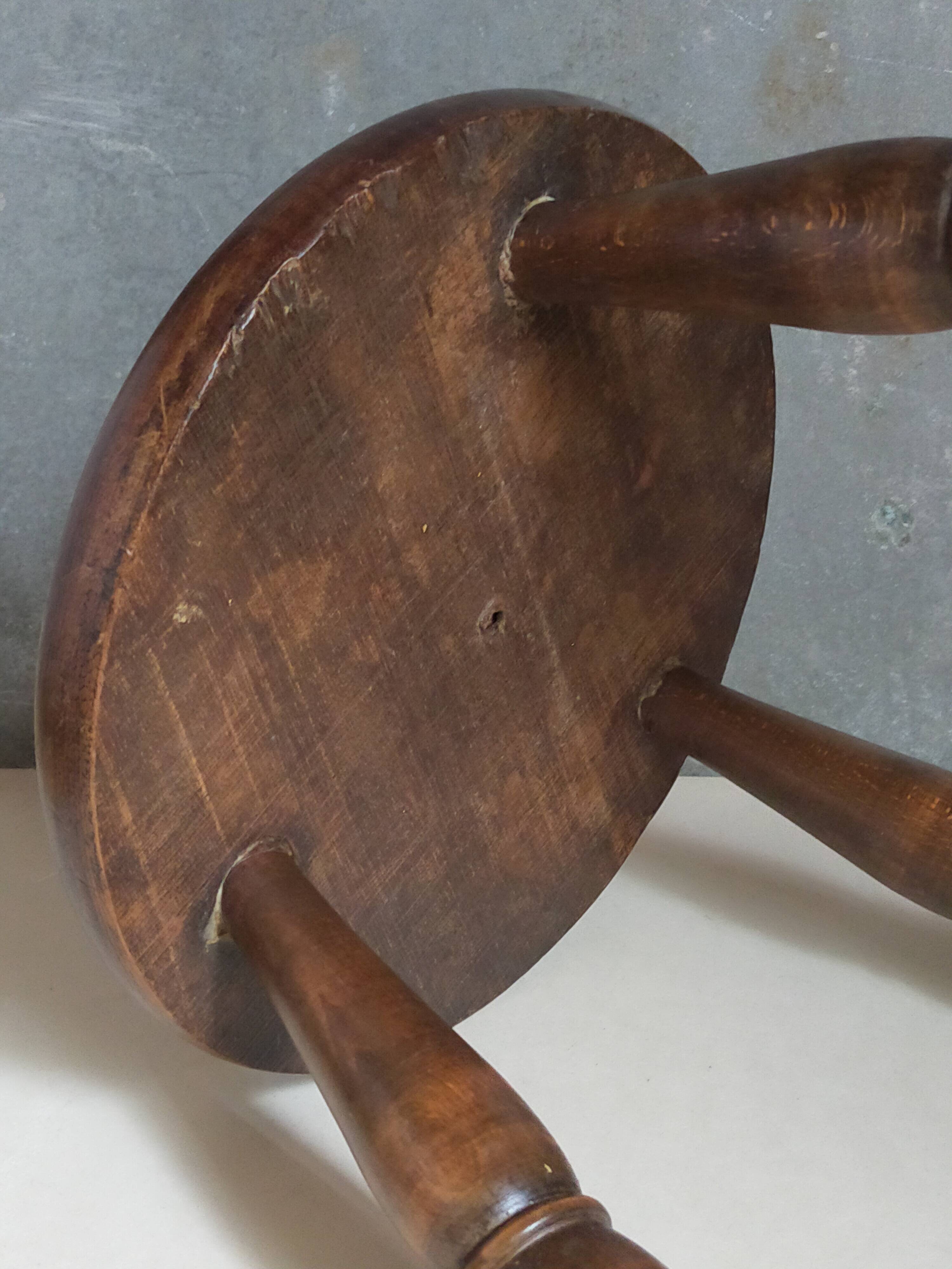 Low tripod stool in vintage turned solid wood